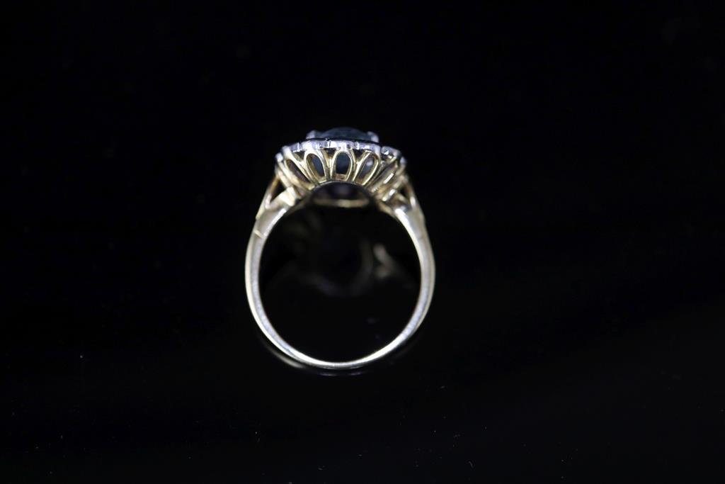 A modern 18ct gold, aquamarine and diamond cluster ring,